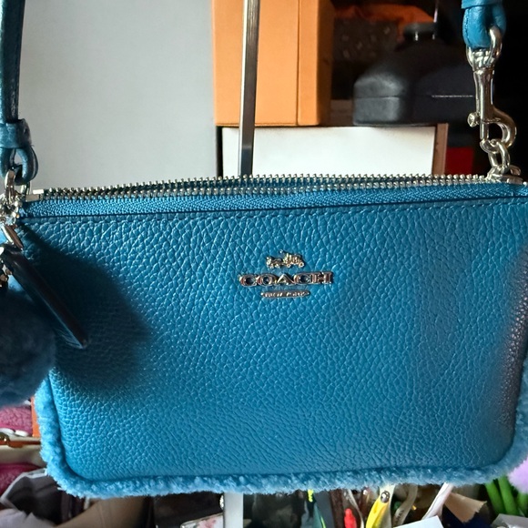 NWT Coach Shearling Pom Pom Charm Key Ring Peacock Blue  Coach Textured Peacock Blue Wristlet with Pom-Pom and hang tag